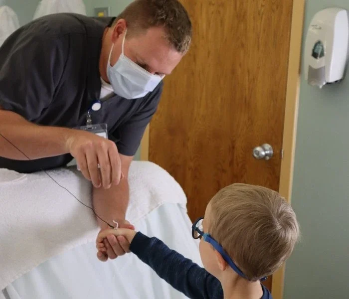 little boy with caregiver